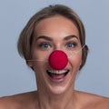 Happy young girl with a clown nose Royalty Free Stock Photo