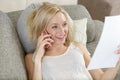 happy young girl relaxing on sofa enjoying Royalty Free Stock Photo