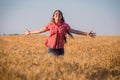Young girl running on field with ripe wheat Royalty Free Stock Photo