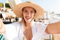 Happy young girl in summer hat and swimwear resting Royalty Free Stock Photo