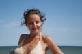 Happy young girl in summer vacation on sea and blue sky background Royalty Free Stock Photo