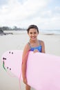 Happy young girl with surfboard Royalty Free Stock Photo