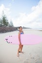 Happy young girl with surfboard Royalty Free Stock Photo