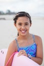 Happy young girl with surfboard Royalty Free Stock Photo