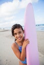 Happy young girl with surfboard Royalty Free Stock Photo