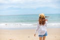 Happy young girl walking on the beach. Summer travel, vocation, holiday concept Royalty Free Stock Photo