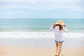 Happy young girl walking on the beach. Summer travel, vocation, holiday concept Royalty Free Stock Photo