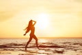 Happy girl walk at sunset beach Royalty Free Stock Photo