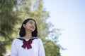 Happy young girl wear student unform at school