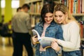 Happy young girls student studing in library Royalty Free Stock Photo