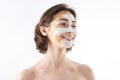 Happy young graceful female with face mask
