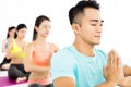 Happy young Group doing yoga exercises Royalty Free Stock Photo