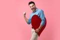 Happy young guy holding big red heart and celebrating Royalty Free Stock Photo