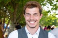 Happy young handsome boy hipster man smiling at the park Royalty Free Stock Photo