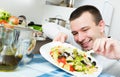 Man examines vegies Royalty Free Stock Photo