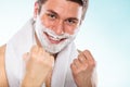 Happy young handsome man with shaving cream foam. Royalty Free Stock Photo