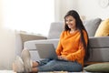 Happy young hindu lady freelancer working on laptop from home Royalty Free Stock Photo