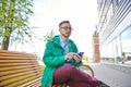 Happy young hipster man with smartphone and bike Royalty Free Stock Photo