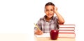 Happy Young Hispanic School Boy At Desk with Books and Apple Isolated on a White Background Royalty Free Stock Photo