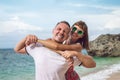 Happy young honeymoon couple having fun on the beach. Ocean, tropical vacation on Bali island, Indonesia. Royalty Free Stock Photo