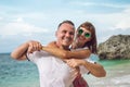 Happy young honeymoon couple having fun on the beach. Ocean, tropical vacation on Bali island, Indonesia. Royalty Free Stock Photo