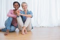 Happy young housemates showing their new house keys Royalty Free Stock Photo