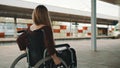 Happy young independent disabled woman on the train station