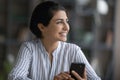 Happy young Indian businesswoman feeling dreamy at home. Royalty Free Stock Photo