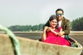 Happy young Indian couple having a good time in the wooden boat Royalty Free Stock Photo