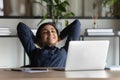 Happy indian female employee relax at workplace Royalty Free Stock Photo