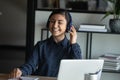 Happy young indian girl listening to music in headphones. Royalty Free Stock Photo