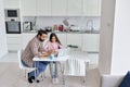 Happy young indian parent father helping teenage daughter learning at home. Royalty Free Stock Photo