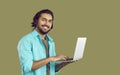 Happy young Indian student or IT specialist using his laptop computer and smiling Royalty Free Stock Photo