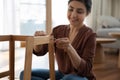 Happy young indian woman enjoy easy mounting flat pack furniture Royalty Free Stock Photo