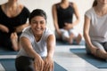 Happy young indian woman in seated forward bend position. Royalty Free Stock Photo