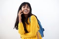 Happy young Indian woman laughing and talking with cellphone on isolated white background Royalty Free Stock Photo