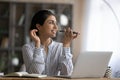 Young Indian woman use cellphone talking on loudspeaker Royalty Free Stock Photo