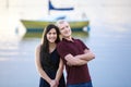 Happy young interracial couple standing together by lake Royalty Free Stock Photo