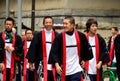 Happy young Japanese men in traditional clothes