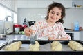 Happy Jewish girl baking sweet Challah bread for Sabbath Jewish Holiday Royalty Free Stock Photo