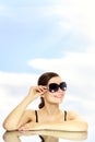 Happy young lady smiling with sunglasses Royalty Free Stock Photo