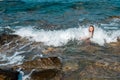 Happy young lady swims at the sea Royalty Free Stock Photo