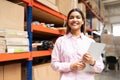 Happy Young Latin Worker With List Working At Factory