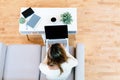 Happy young latina woman using her laptop at home Royalty Free Stock Photo