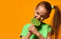 Happy young little child girl kid bite sweet lollypop candy Royalty Free Stock Photo