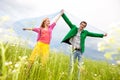 Happy Young love Couple - jumping under blue sky Royalty Free Stock Photo