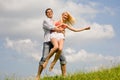Happy Young love Couple - jumping under sky Royalty Free Stock Photo