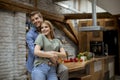 Happy young lovely couple in the kitchen hugging each other Royalty Free Stock Photo