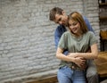 Happy young lovely couple in the kitchen hugging each other Royalty Free Stock Photo