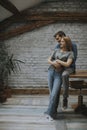 Happy young lovely couple in the kitchen hugging each other Royalty Free Stock Photo